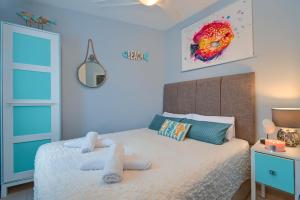 Ein Bett oder Betten in einem Zimmer der Unterkunft Apartment Octopus