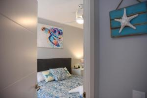 Ein Bett oder Betten in einem Zimmer der Unterkunft Apartment Octopus