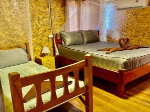 Postel nebo postele na pokoji v ubytování Goyao Family Bungalow + 89 fotografií