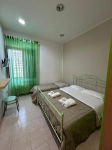 Postel nebo postele na pokoji v ubytování G&A Conte B&B