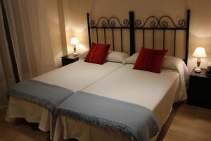 Posteľ alebo postele v izbe v ubytovaní Hostal Mainz