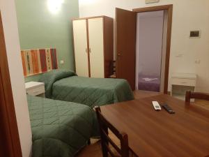 Posteľ alebo postele v izbe v ubytovaní Locanda Scirocco
