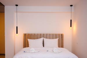 Ένα ή περισσότερα κρεβάτια σε δωμάτιο στο Apartmani VIZIJA