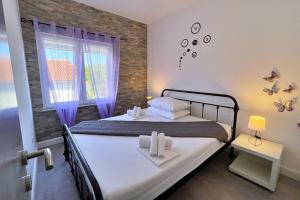 Posteľ alebo postele v izbe v ubytovaní Top Apartments