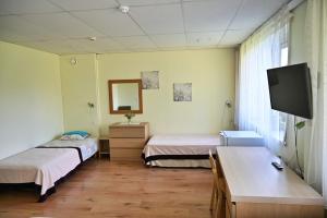 Postel nebo postele na pokoji v ubytování Vinni Hostel