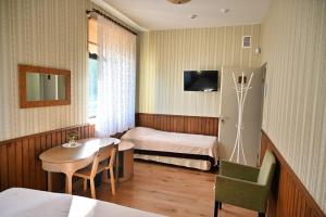 TV a/nebo společenská místnost v ubytování Vinni Hostel