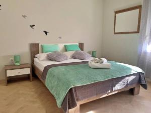 Łóżko lub łóżka w pokoju w obiekcie Apartment Rozi