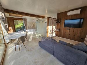 A television and/or entertainment centre at EcoResort Il Cantico della Natura