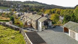 an aerial view of a village with a house at Lakes Cottage in Backbarrow