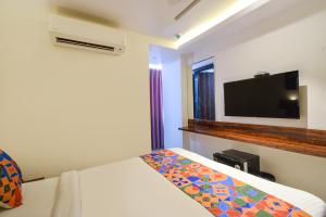 Ένα ή περισσότερα κρεβάτια σε δωμάτιο στο FabHotel Prime Prowell Apex - Nr Google office, Hitex, Kondapur