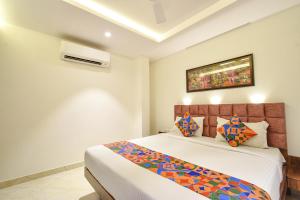Ένα ή περισσότερα κρεβάτια σε δωμάτιο στο FabHotel Prime Prowell Apex - Nr Google office, Hitex, Kondapur