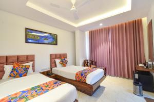 Ένα ή περισσότερα κρεβάτια σε δωμάτιο στο FabHotel Prime Prowell Apex - Nr Google office, Hitex, Kondapur