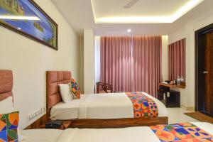 Ένα ή περισσότερα κρεβάτια σε δωμάτιο στο FabHotel Prime Prowell Apex - Nr Google office, Hitex, Kondapur