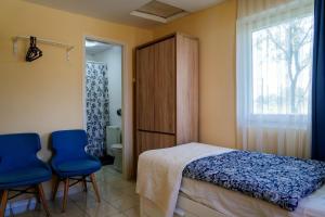 Posteľ alebo postele v izbe v ubytovaní Kamala Kutir