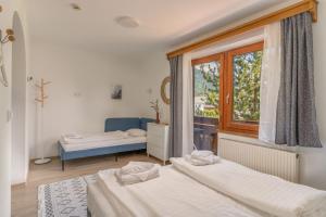 Postel nebo postele na pokoji v ubytování Nada Apartman