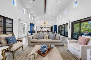 a living room with two couches and a table at Lakeview Landing and Concierge Services in Cottonwood Shores