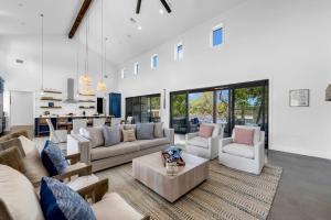 a large living room with couches and a table at Lakeview Landing and Concierge Services in Cottonwood Shores +44 photos