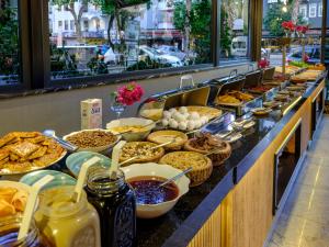 a buffet line with many different types of food at Aria Riva Apart Hotel in Alanya