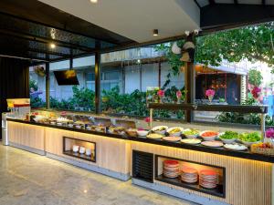 a buffet line with plates of food on display at Aria Riva Apart Hotel in Alanya