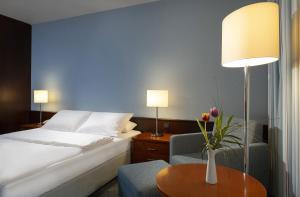 Postel nebo postele na pokoji v ubytování Maritim Hotel Darmstadt