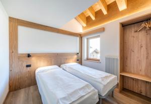 A bed or beds in a room at Residence Nevegall