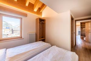 A bed or beds in a room at Residence Nevegall
