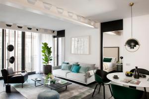 a living room with a couch and a table at The Passage Homes - Simaba Group in Barcelona