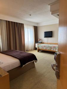 Postel nebo postele na pokoji v ubytování Flat Guarulhos - 2