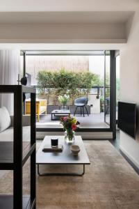 a living room with a couch and a table at The Passage Homes - Simaba Group in Barcelona