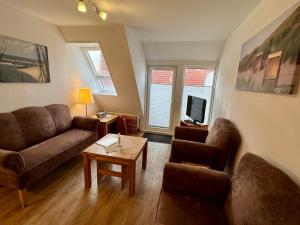 TV a/nebo společenská místnost v ubytování Uhlenkamp Appartement -7- im UHLENKAMP