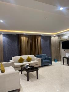 Posezení v ubytování رمادا نيت للشقق المخدومة