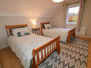 Postel nebo postele na pokoji v ubytování Gooseberry Cottage