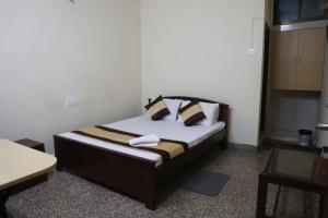 Postel nebo postele na pokoji v ubytování Hotel Embassy