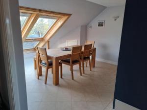 a dining room with a wooden table and chairs at Seaview in Montrose
