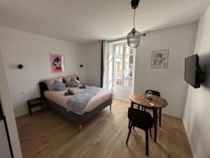Ένα ή περισσότερα κρεβάτια σε δωμάτιο στο GuestReady - Charming Stay near Paris