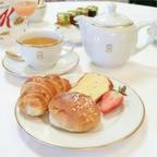 a plate of pastries and cups of tea on a table at Chalet Espace Lumière - Spa, sauna et salle de fitness in Méolans