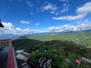 a view of the mountains from the balcony of a house at PuVi Homestay, Dzukou entry point in Viswema