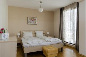 Ένα ή περισσότερα κρεβάτια σε δωμάτιο στο VIP Apartments Sofia