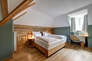 Postel nebo postele na pokoji v ubytování Hotel Uhland