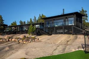 a large house with a large driveway in front of it at Stay North - Armas in Töfsala