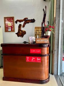 a reception desk at a restaurant with signs on it at HT Phuong Thao Boutique in Nha Trang