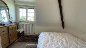 Ένα ή περισσότερα κρεβάτια σε δωμάτιο στο Villa sur la plage Deauville