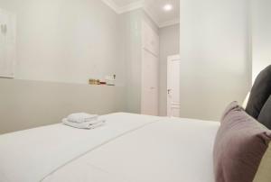 A bed or beds in a room at Minty Stay - Atocha 4 BD