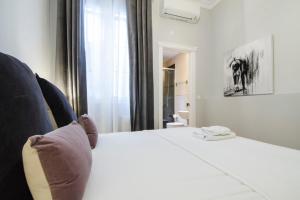 A bed or beds in a room at Minty Stay - Atocha 4 BD