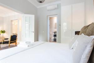A bed or beds in a room at Minty Stay - Atocha 4 BD