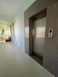 a lobby with a elevator in a building at HT Phuong Thao Boutique in Nha Trang
