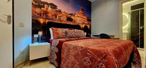 a bedroom with a large bed with a painting of the eiffel tower at Il Magnifico Superior Rooms 400m from Tiburtina Railway Station and 290m from Metro in Rome