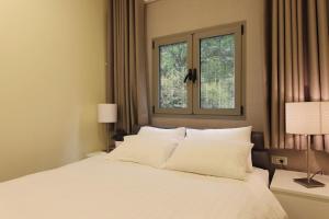 Postel nebo postele na pokoji v ubytování Idelson Hotel