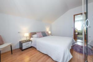 Ein Bett oder Betten in einem Zimmer der Unterkunft Villa Nick
