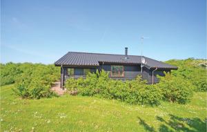 a house in the middle of a field at Holiday Home Hellesvej Vestervig Denm in Vestervig